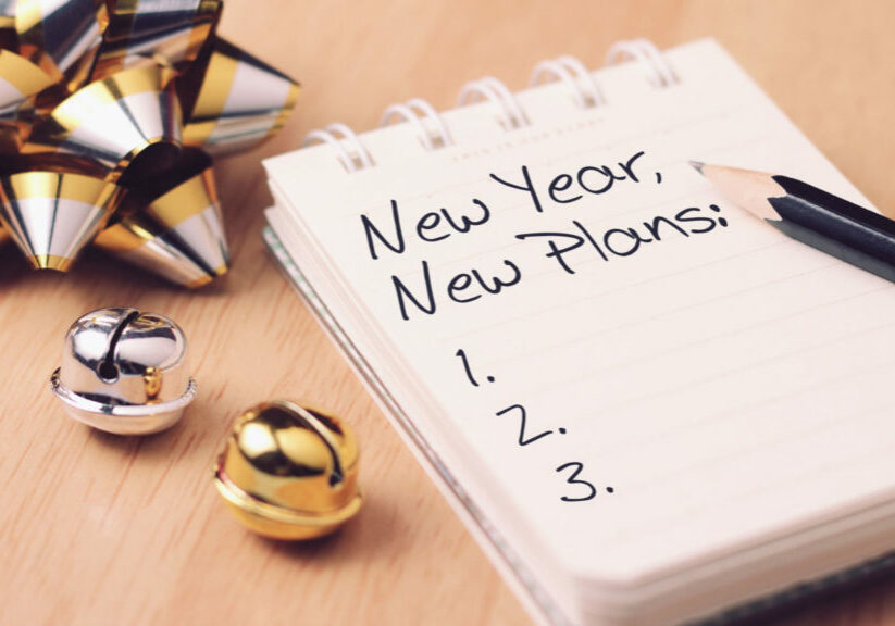 New year new plan with decoration. Discover how setting goals can bring more happiness in your life.